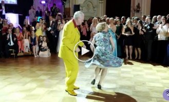 An elderly couple is rocking the dance floor