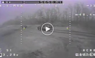 A kamikaze drone destroys a Russian armored personnel carrier along with troops on the armor