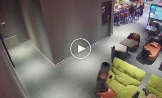 Curiosity in a cafe: a chair overturned with a customer inside