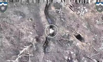 A Ukrainian drone drops grenades and ammunition into Russian military trenches in the Donetsk region