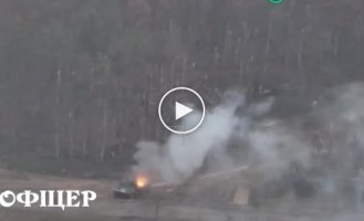 A Russian armored personnel carrier along with its personnel is on fire in the vicinity of the village of Krynki, Kherson region