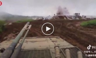 During a Chinese military demonstration, a smoke grenade flew directly towards officials