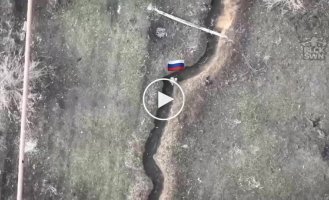 An occupier in a trench gestures for cigarettes from his drone, but receives a mine from a Ukrainian