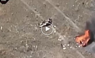 A biker occupier runs away as fast as he can, leaving his comrade who was hit by a drone