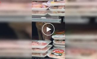 A ginger cat made himself lunch right in the supermarket display case