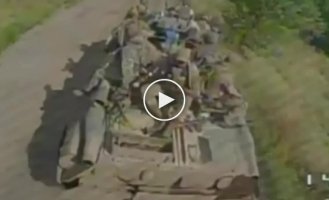 Donetsk region, arrival of a Ukrainian FPV drone on a Russian armored personnel carrier with armored infantry