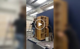 A cabinet in the shape of a multi-story building.