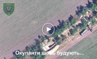 A Ukrainian GMLRS missile hit a Russian crane that was constructing a position on the edge of a forest