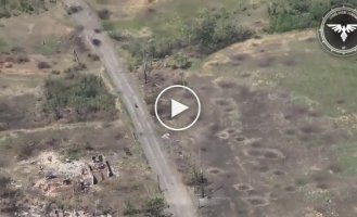 Occupant on a motorcycle and kamikaze drone