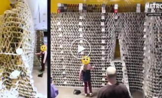 A girl destroyed a structure made of beer coasters