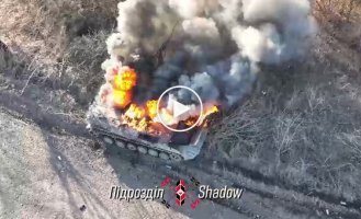 Air bombers accurately drop ammunition and destroy a Russian infantry fighting vehicle with a liquidated occupier lying on its armor.