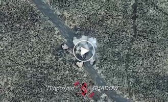 A Ukrainian drone drops ammunition on Russian infantry in the Avdeevka area of the Donetsk region