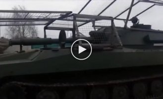 Ukrainian 122-mm self-propelled howitzer 2S1 "Gvozdika" with a UAV network to combat kamikaze on the turret and hull