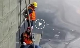 Not stokers or carpenters. High-altitude workers who are not afraid of heights dismantle the structure