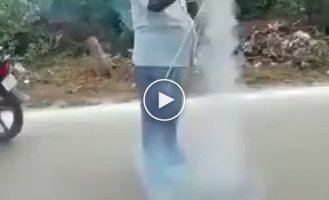 Hindu man lights fireworks for two