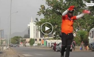 A traffic controller from Africa "dances" right on the track