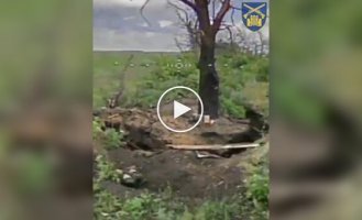 A Russian man burns in a trench after a drone strike