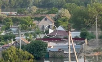 The collapse of a residential building in the flood zone in the Kherson region