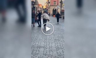 A man believed to be Russian is being beaten on the street of a Polish city