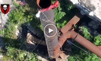 Ukrainian FPV kamikaze drone destroys a Russian surveillance camera mounted on a tall pipe