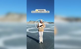 A girl poured boiling water on the ice on a lake.