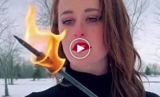 A very dexterous girl with a bow and a burning arrow