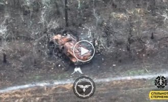 Avdiivka direction, a Ukrainian FPV drone flies into a destroyed armored personnel carrier in which Russian soldiers were hiding