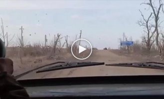 The moment a Ukrainian FPV drone lands on a Russian military vehicle in the Avdeevka area