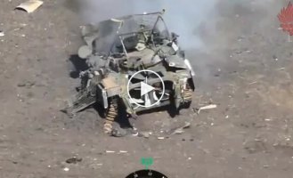 An enemy armored vehicle explodes along with the occupiers from a kamikaze drone strike