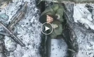 Donetsk region, a Ukrainian drone drops a grenade into a Russian military trench