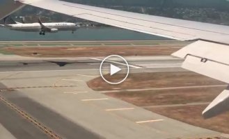 Two passenger planes landing at the same time