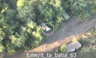 Ukrainian drones monitor three trucks parked among trees in the Lugansk region during the day