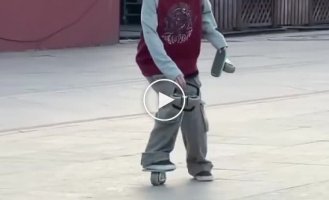 A graceful girl skates on unusual roller skates