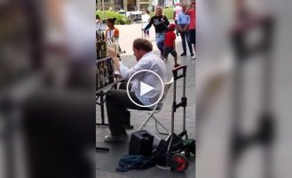 A man plays on water bottles