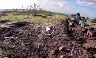 Ukrainian soldiers in captured Russian trenches