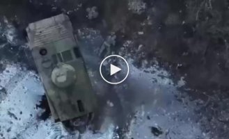 A Ukrainian drone drops a grenade on a Russian BMP-1 landing force in the Avdeevka area