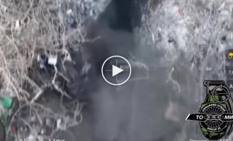 Donetsk region, a Ukrainian drone drops grenades into a Russian military trench