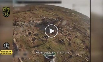 A piece of the occupier lies on the ruins of the house