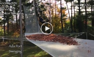 Spectacular fall on a trampoline with a pile of leaves