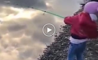 The girl who was fishing with her dad managed to catch a decent fish