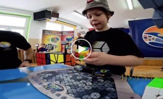 A nine-year-old boy broke the world record for solving a Rubik's cube.