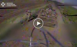 A kamikaze drone attacks a Russian loaf of bread marked Z, as well as an armored fighting vehicle and three trucks