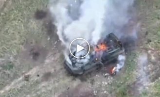 A Russian and his armored personnel carrier are burning out on Ukrainian soil