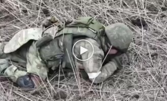 An occupier on the battlefield crosses himself twice and then crawls after his bare-assed brother