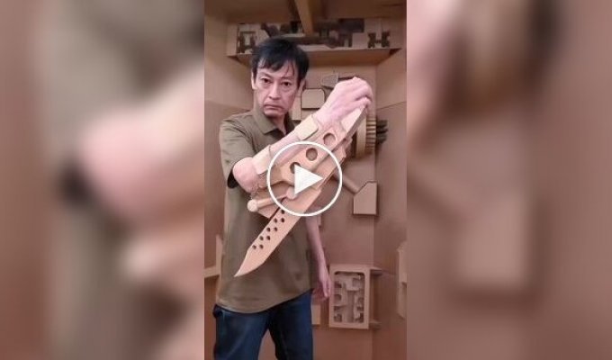A man creates incredible things out of cardboard with mechanical parts