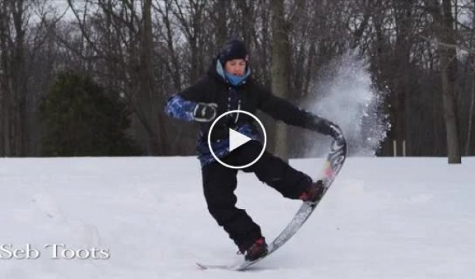 Профессиональный сноубордист показывает класс