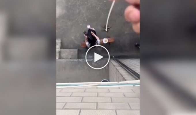 A guy stole food from a girl using a rope and a bug.