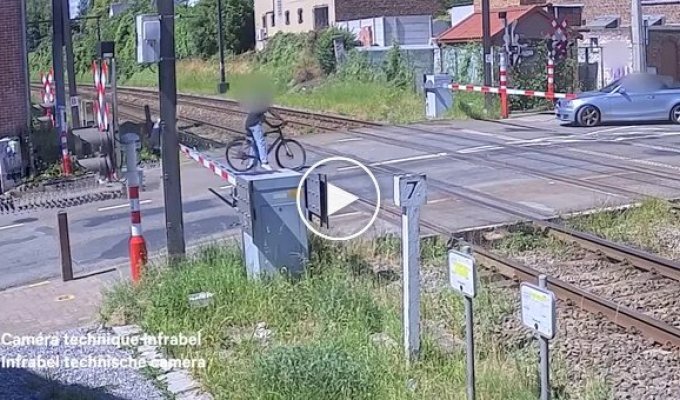 A cyclist almost got hit by a train