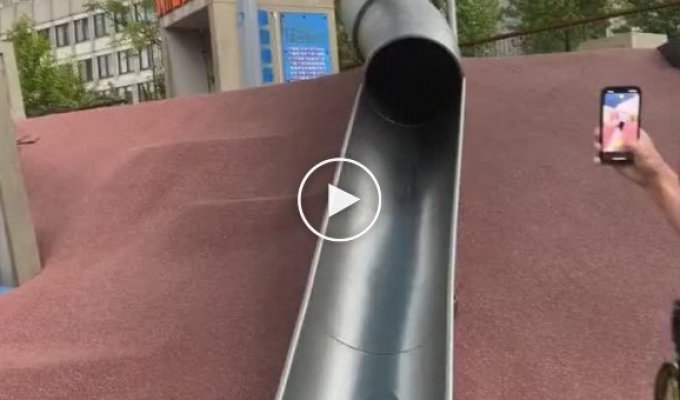 The policeman decided to ride down the children's slide and almost broke his neck