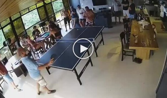 A man broke a ping pong table while trying to beat his opponent.